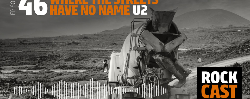 A concrete mixer driving on a lonely road. Overlay text reads "Episode 46 Where the Streets have no Name U2."
