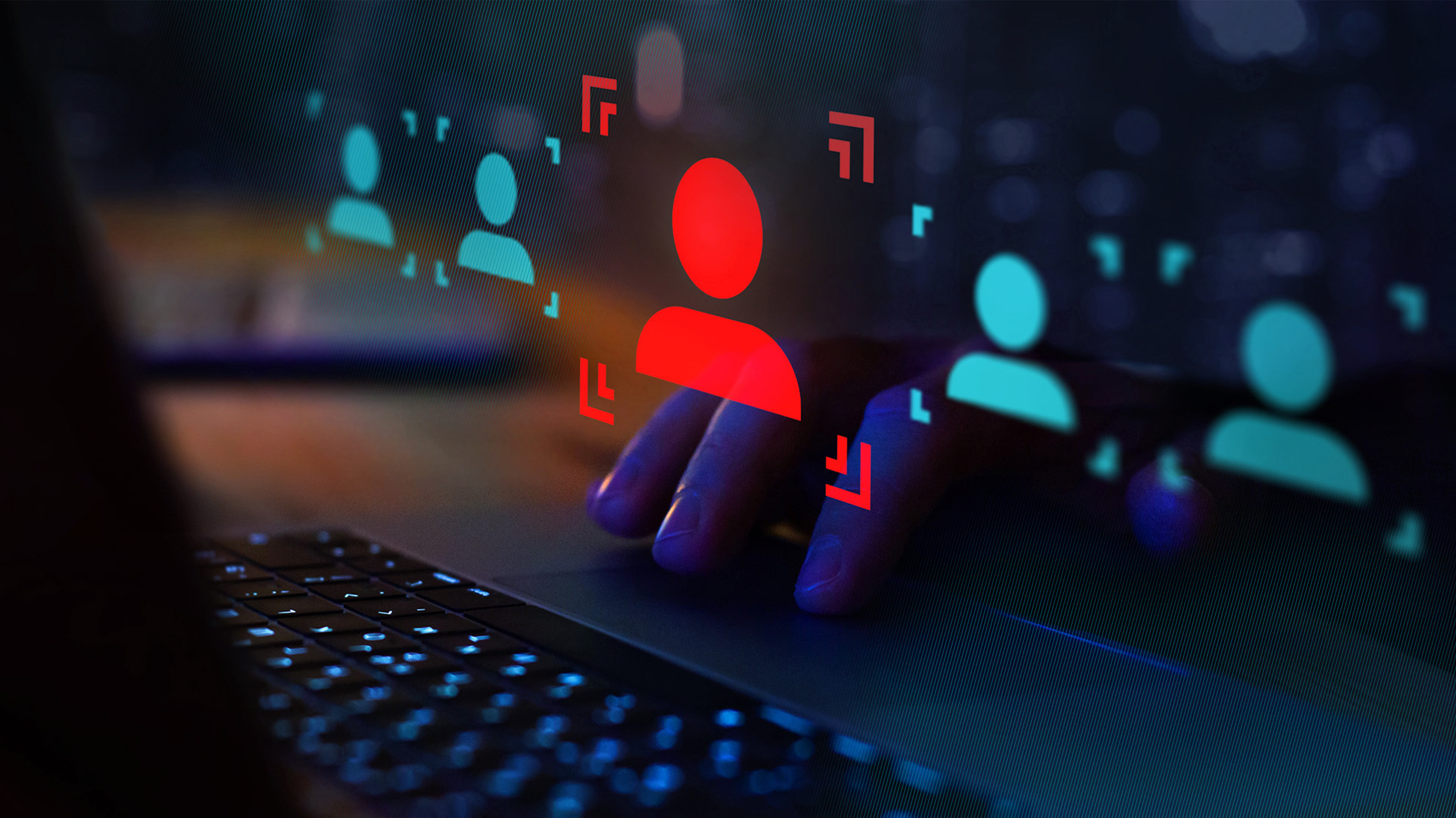 aptop, with digital user recognition symbols illustrating biometric technology in action.