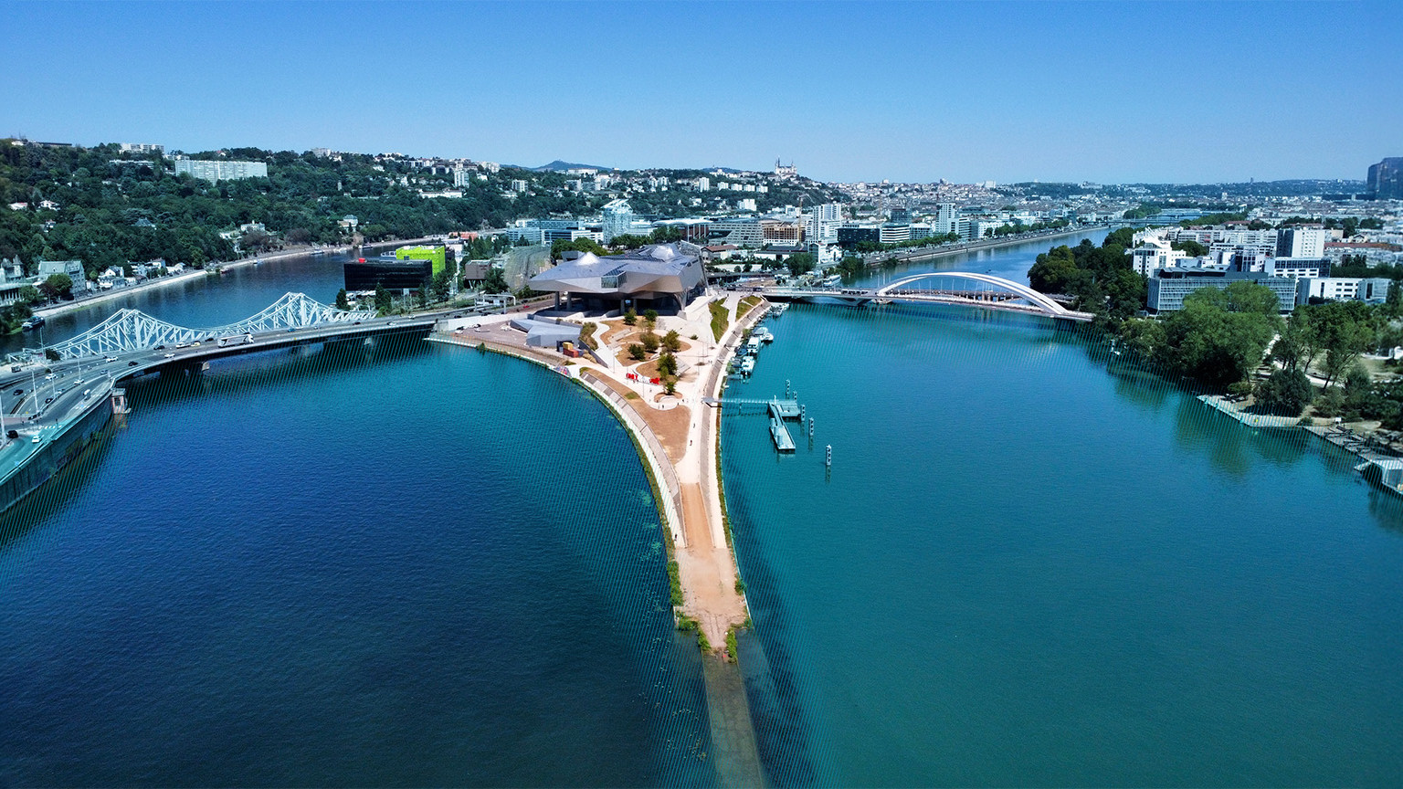 Confluence of the Rhône and Saône rivers in Lyon, symbolizing FRAML, the fusion of fraud prevention and AML.