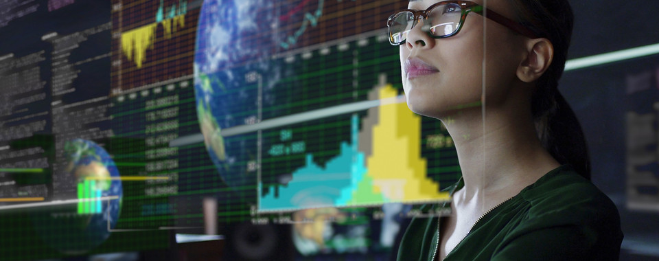 Woman watching risk monitoring data on screen