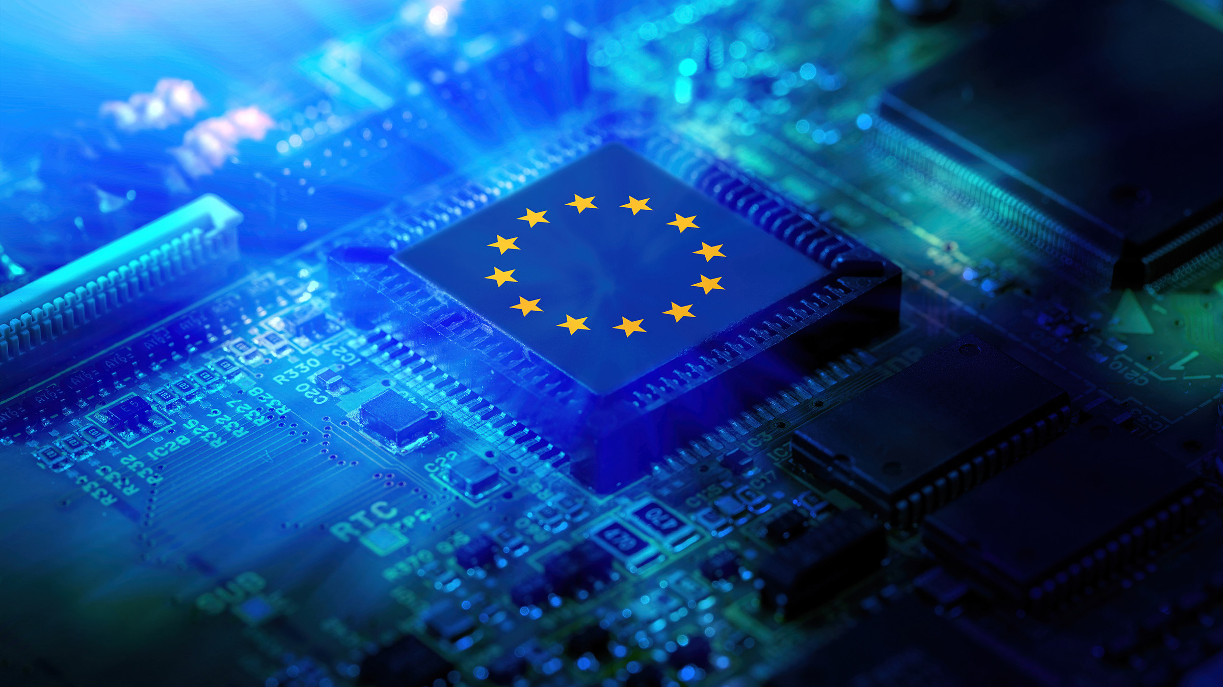 Close-up of a microchip featuring the European Union flag, symbolizing innovation in technology and EU digital strategy.