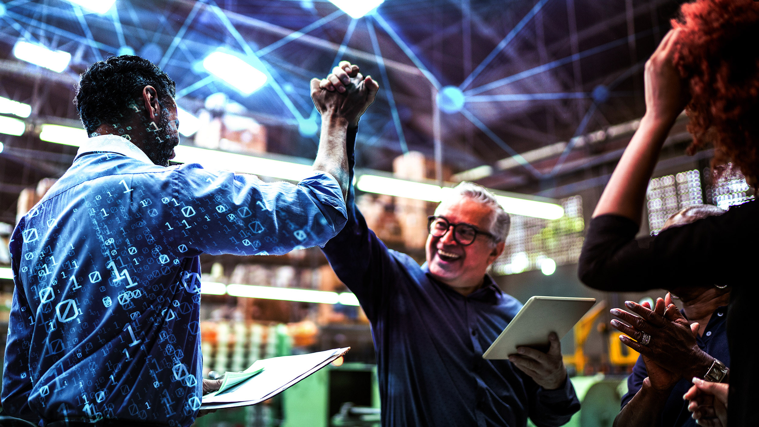 brate success in a modern warehouse with digital elements and tablets in hand.