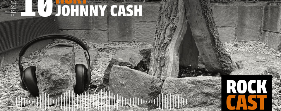 Headphones on a stone next to a campfire. Overlay text reads "Episode 10 Hurt Johnny Cash."