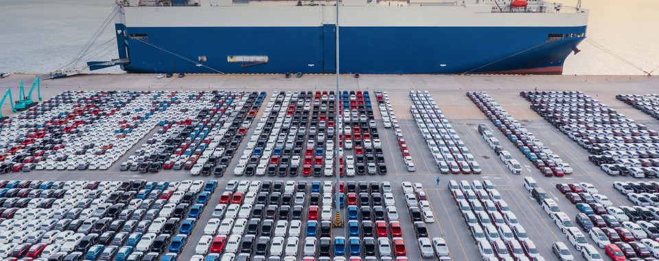 Port with a Ro/Ro-Vessel and a Yard full of finished vehicles