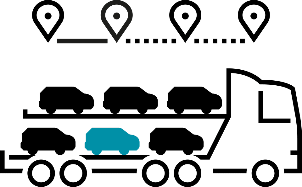 Car carrier truck transporting multiple vehicles on a highway under a clear blue sky.