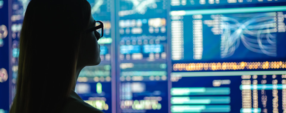 Woman looking at screen with data of financial institutions