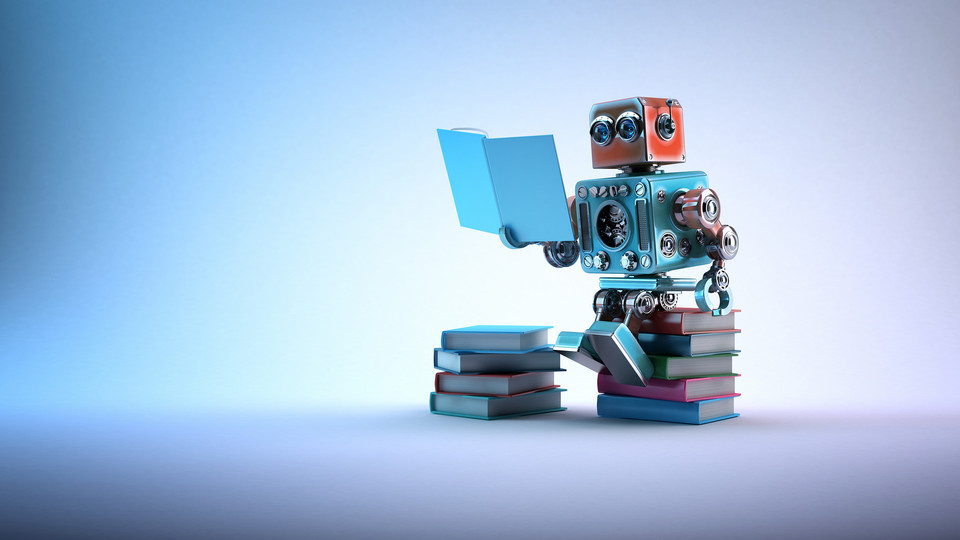 Whimsical robot reading a book while perched on colorful stacked books against a soft blue background.