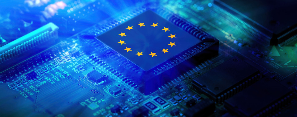 Close-up of a microchip featuring the European Union flag, symbolizing innovation in technology and EU digital strategy.